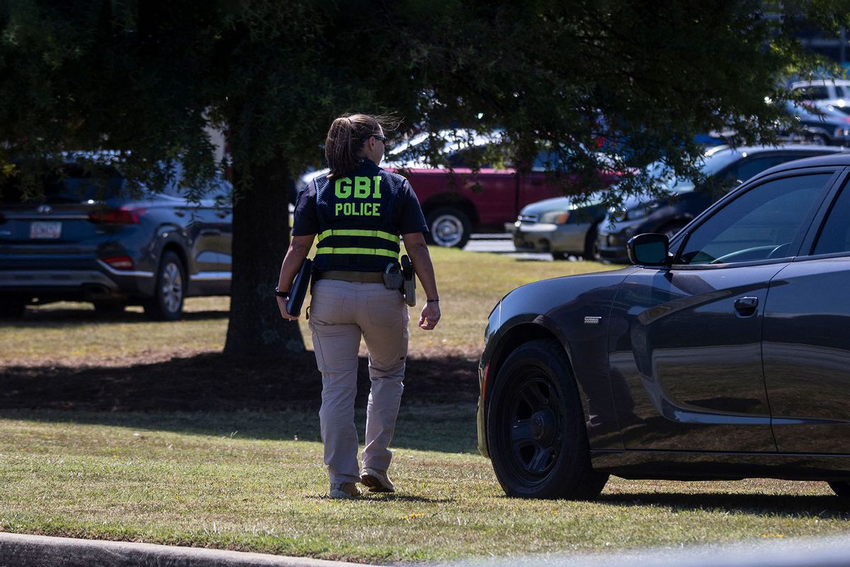 A Georgia Bureau of Investigations (GBI) officer, other law enforcement, and first responders respond to Apalachee High School in Winder, Georgia, on September 4, 2024, after a shooting was reported. (CHRISTIAN MONTERROSA/AFP via Getty Images)