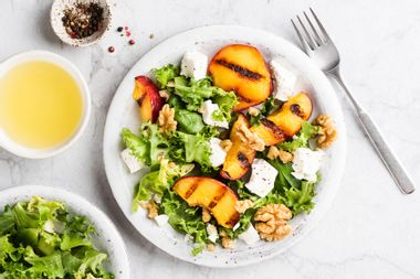 Summer salad with grilled peaches and feta cheese