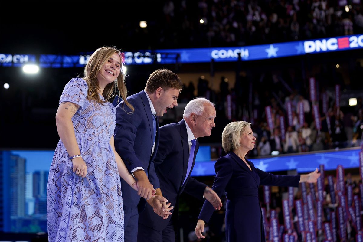 Democratic vice presidential nominee Minnesota Gov. Tim Walz celebrates with his daughter Hope Walz (L), son Gus Walz (2nd-L) and wife Gwen Walz (R) after accepting the Democratic vice presidential nomination on stage during the third day of the Democratic National Convention at the United Center on August 21, 2024 in Chicago, Illinois. (Justin Sullivan/Getty Images)