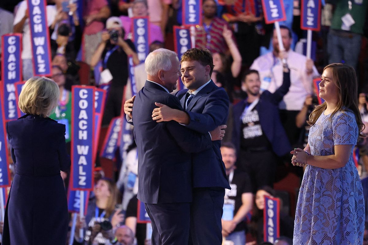 Minnesota Governor and 2024 Democratic vice presidential candidate Tim Walz, his wife Gwen Walz (L) and children Gus and Hope hug on stage on the third day of the Democratic National Convention (DNC) at the United Center in Chicago, Illinois, on August 21, 2024. (CHARLY TRIBALLEAU/AFP via Getty Images)