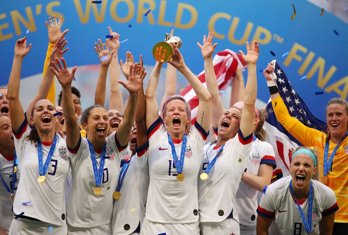 Megan Rapinoe of the USA lifts the FIFA Women's World Cup Trophy following her team's victory in the 2019 FIFA Women's World Cup France Final match between The United States of America and The Netherlands at Stade de Lyon on July 07, 2019 in Lyon, France.  (Getty/Richard Heathcote)